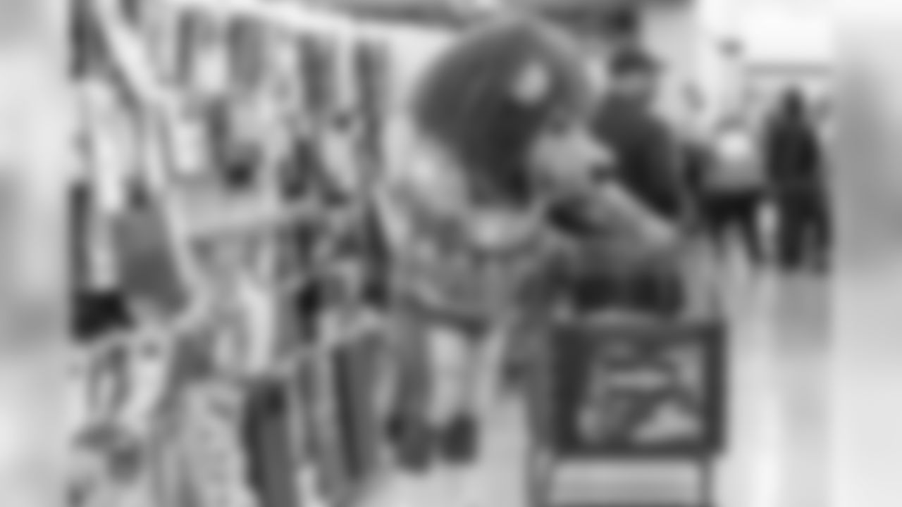 Roary shops with students from Detroit Lions Academy at Shop with a Lion at Meijer on Tuesday, Dec. 4, 2018 in Detroit.