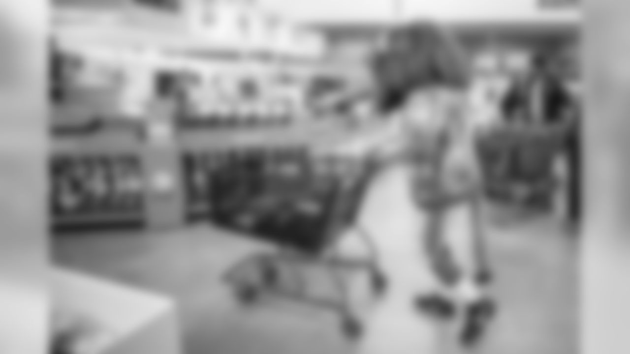 Roary shops with students from Detroit Lions Academy at Shop with a Lion at Meijer on Tuesday, Dec. 4, 2018 in Detroit.