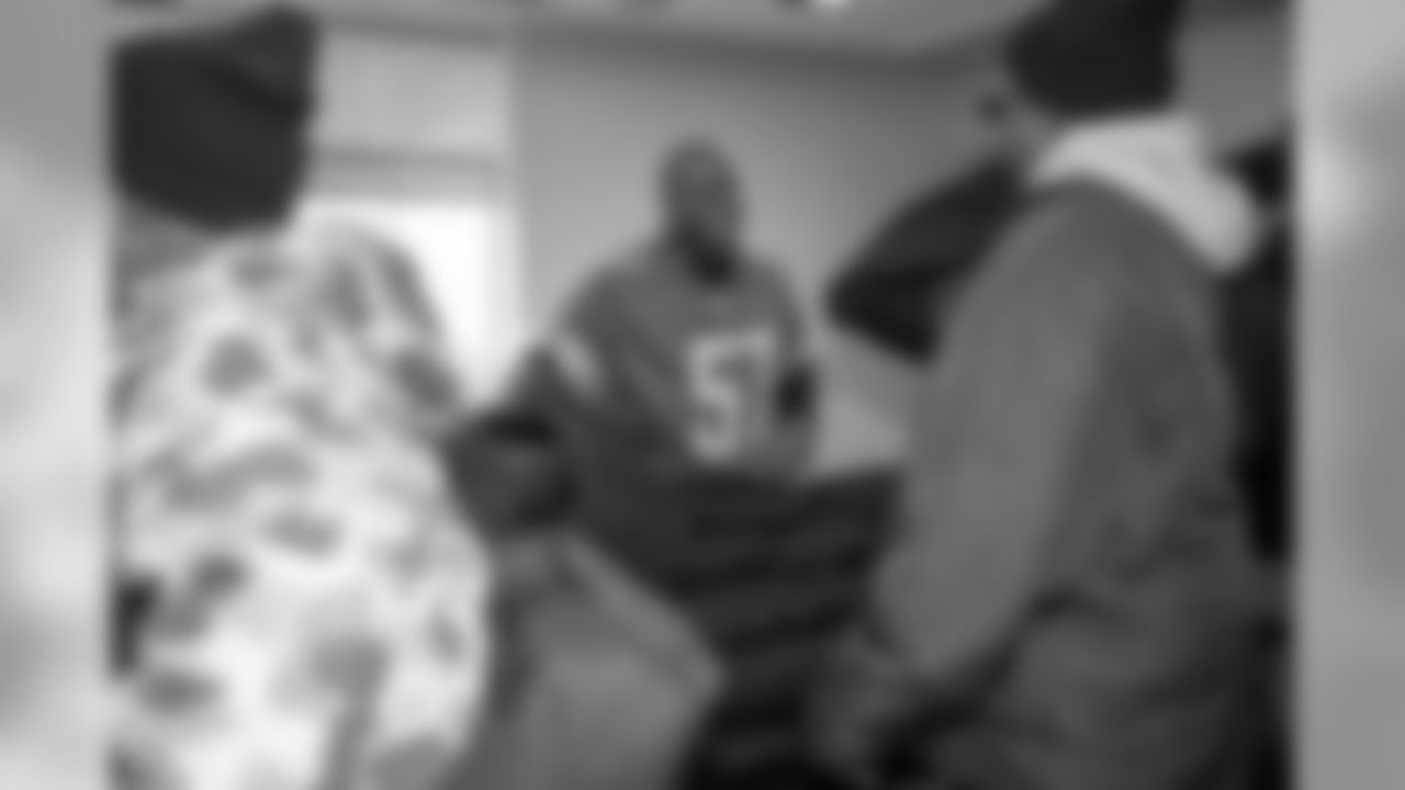 Tim Walton hands out Empowerment Plan coats to homeless veterans on Thursday, Nov. 8, 2018 in Detroit.