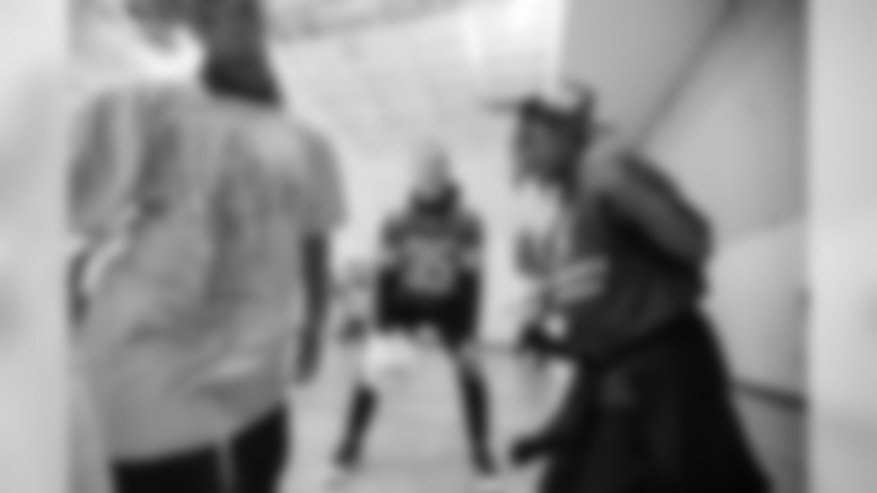 Detroit Lions safety Miles Killebrew (35) officiates a game of rock-paper-scissors at a real players don't bully assembly with Playworks at Hutchinson Elementary School on Tuesday, Oct. 22, 2018 in Detroit.