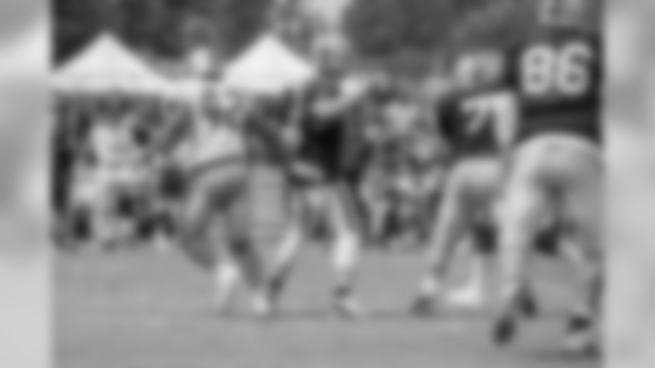 Detroit Lions linebacker Devon Kennard (42) "sacks" Oakland Raiders quarterback Derek Carr (4) during training camp practice on Wednesday, Aug. 8, 2018 in Napa, Calif. (Detroit Lions via AP)