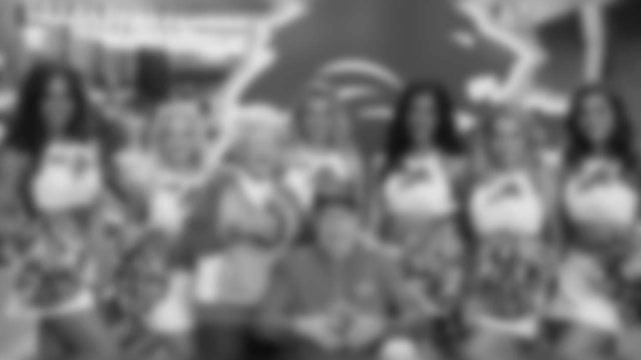 Detroit Lions cheerleaders take a photo with the Applebee's hometown hero before the Detroit Lions NFL football game against the Green Bay Packers on Sunday, Oct. 7, 2018 in Detroit.