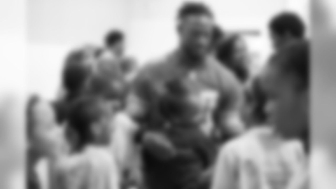 Detroit Lions cornerback Nevin Lawson (24) hugs a student at a real players don't bully assembly with Playworks at Hutchinson Elementary School on Tuesday, Oct. 22, 2018 in Detroit.