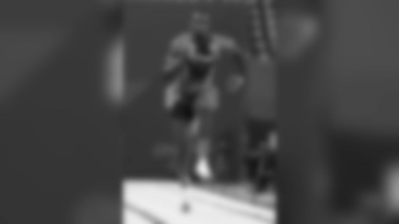 Michigan wide receiver Devin Funchess runs the 40-yard dash at the NFL football scouting combine in Indianapolis, Saturday, Feb. 21, 2015. (AP Photo/Julio Cortez)