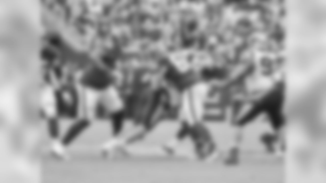Julius Peppers strip-sacks Alex Smith in a game against Washington in 2018.