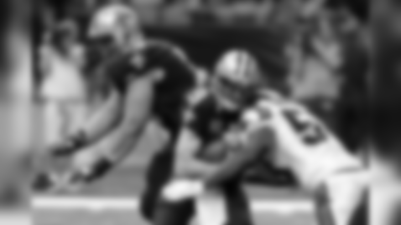 New Orleans Saints quarterback Drew Brees (9) is sacked by Carolina Panthers outside linebacker Thomas Davis in the second half of an NFL football game in New Orleans, Sunday, Dec. 6, 2015. (AP Photo/Jonathan Bachman)
