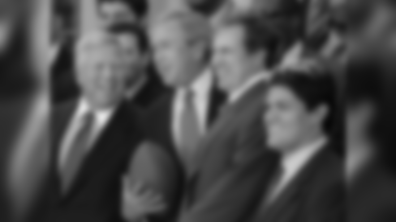 President Bush poses for a picture in the Rose Garden of the White House with New England Patriots owner, Bob Kraft, left, head coach, Bill Belichik, second from right, Tedy Bruschi, right, and the rest of the football team Wednesday, April 13, 2005, in Washington. President Bush has welcomed the Patriots to the White House for winning the 2005 Super Bowl. (AP Photo/Lawrence Jackson)
