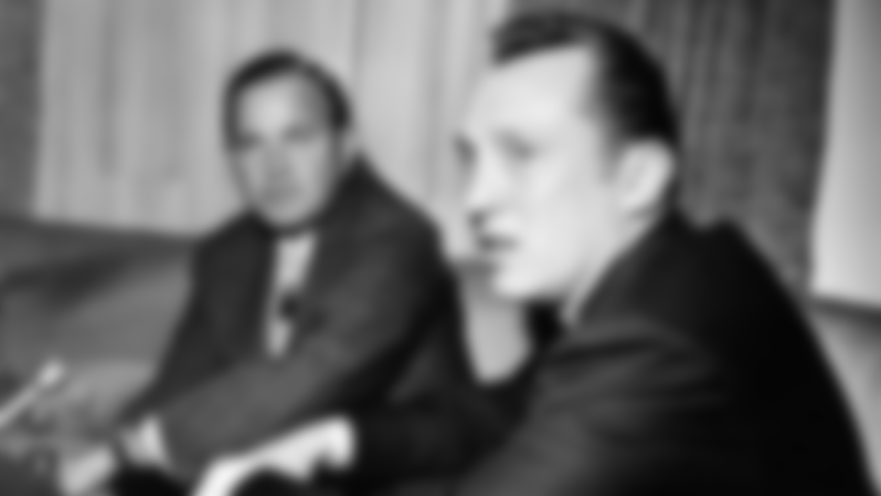 Al Davis, right, the head coach-general manager of the Oakland Raiders, was named, April 8, 1966 in Houston, as the new American Football League Commissioner to succeed Joe Foss, who resigns yesterday. The selection of Davis was made by Ralph Wilson, left, President of the AFL and owner of the Buffalo Bills. Davis, 36, recognized in professional football for his organizational ability and coaching skill, transformed the Raiders from perennial losers to one of the league?s most respected teams in three seasons. (AP Photo/Ed Kolenovsky)