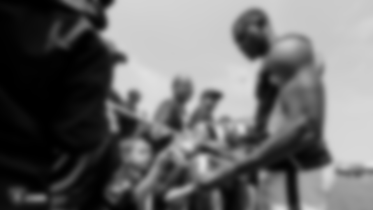Oakland Raiders wide receiver Johnny Holton (16) signs autographs for fans after practice at 2018 Training Camp at The Oakland Raiders Napa Valley Training Complex, Sunday, July 29, 2018, in Napa, California.