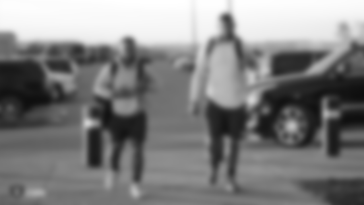 Raiders running back James Butler and tackle Jamar McGloster arrive for the teams first day of offseason program at the Raiders Practice Facility in Alameda, Calif.