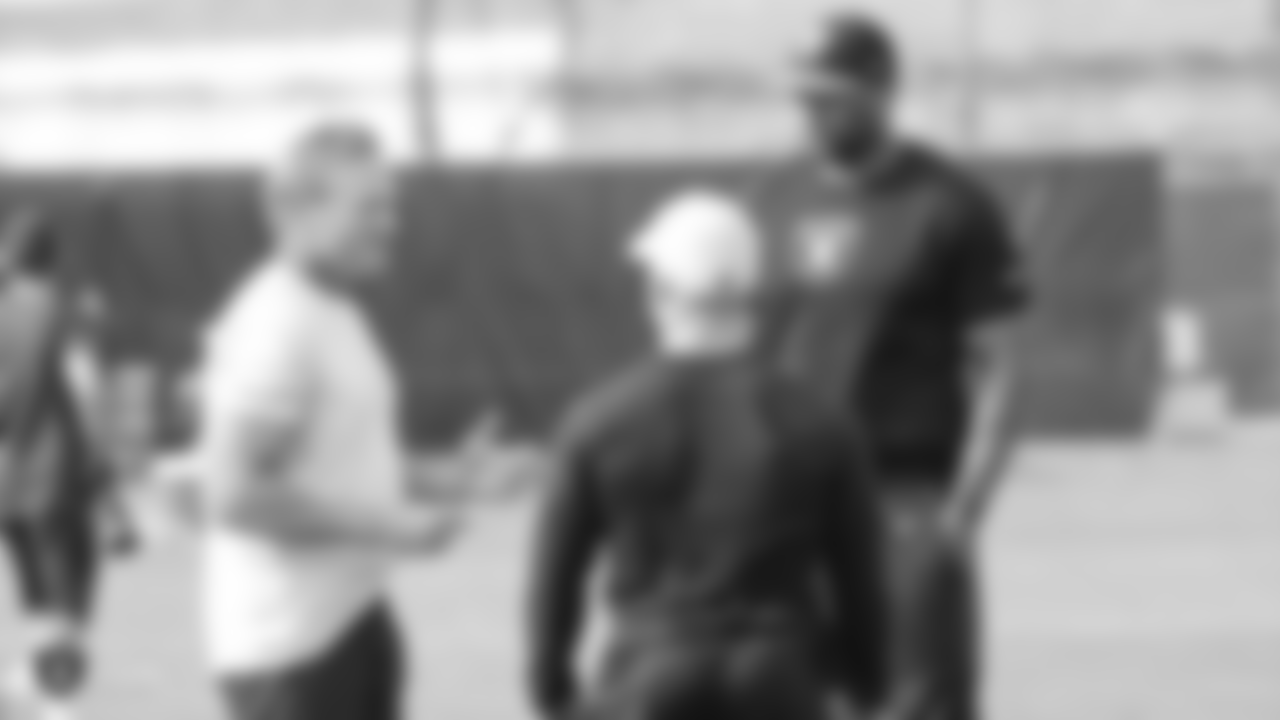 Oakland Raiders head coach Jon Gruden, strength and conditioning assistant Deuce Gruden, and strength and conditioning assistant D'Anthony Batiste on the field for practice at the Oakland Raiders Practice Facility, Thursday, November 8, 2018, in Alameda, California.