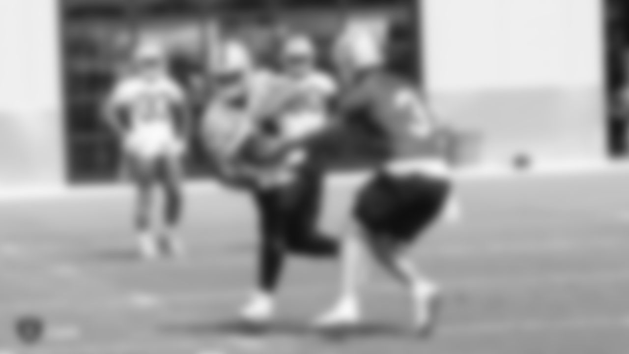 Raiders running back Chris Warren III (34) and quarterback Nathan Peterman (3) at an Organized Team Activity (OTA) at the Raiders Practice Facility in Alameda, Calif.