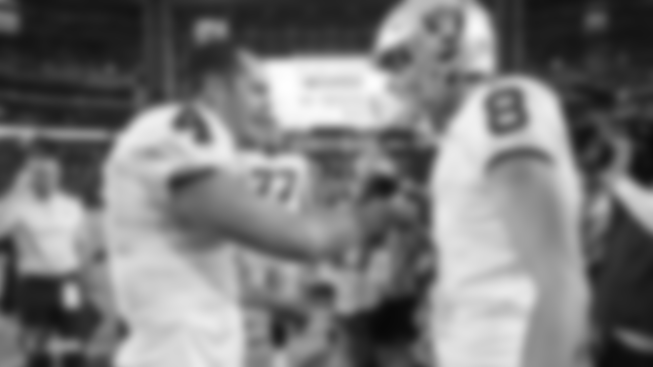 Oakland Raiders quarterback Derek Carr (4) and kicker Daniel Carlson (8) after the Oakland Raiders regular season game against the Arizona Cardinals at State Farm Stadium, Sunday, November 18, 2018, in Glendale, Arizona. The Oakland Raiders won 23-21.