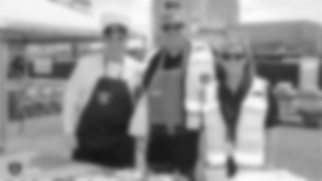 Oakland Raiders owner Mark Davis, vice president of security Dean Stavert, and other staff members from The Oakland Raiders front office spend the day with construction workers of the Las Vegas Stadium worksite by handing out lunches and sharing a meal, Wednesday, June 28, 2018, at the Las Vegas Stadium worksite in Las Vegas, Nevada.