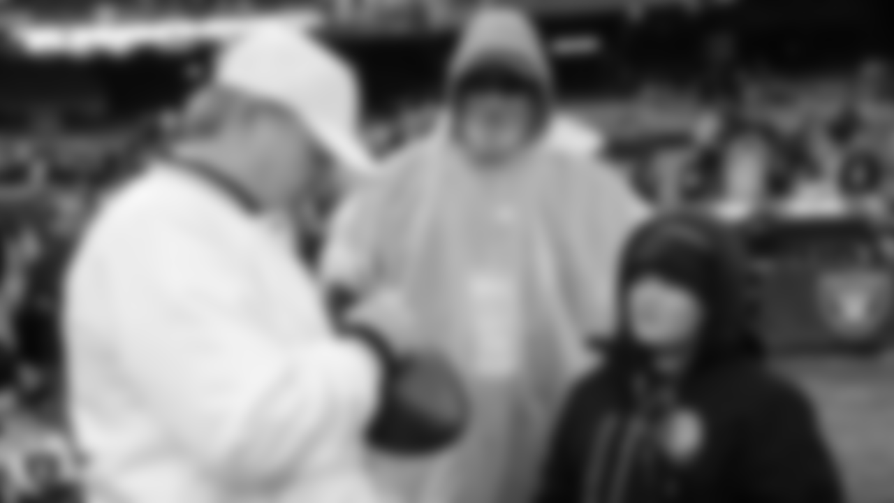 Zander of the Make-A-Wish Foundation stands with his family on the sidelines before the Oakland Raiders regular season game against the Denver Broncos at Oakland-Alameda County Coliseum, Monday, December 24, 2018, in Oakland, California. The Oakland Raiders won 24-17.
