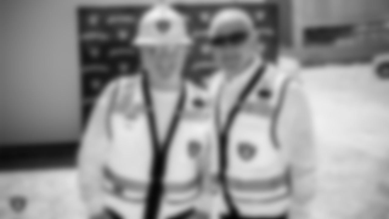 Raiders owner Mark Davis and Raiders president Marc Badain at the Henderson Headquarters worksite by handing out lunches and sharing a meal.