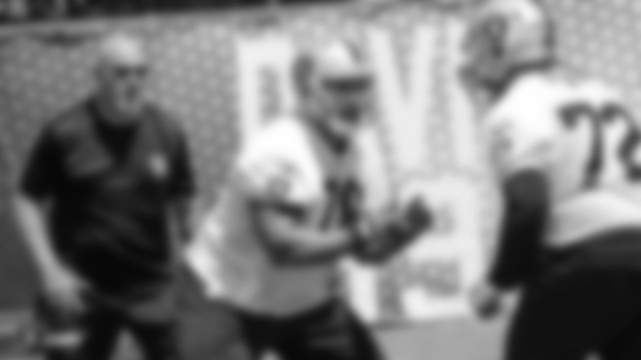 Oakland Raiders offensive line coach Tom Cable, offensive guard Jon Feliciano (76), and offensive tackle Donald Penn (72) at an Organized Team Activity (OTA) at the Oakland Raiders Practice Facility, Tuesday, June 5, 2018, in Alameda, California.