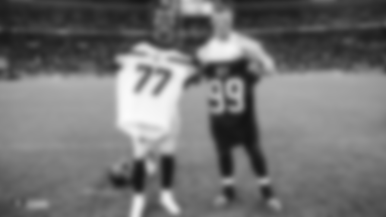 Oakland Raiders defensive end Arden Key (99) swaps jerseys with Seattle Seahawks center/guard Ethan Pocic (77) after the Oakland Raiders regular game against the Seattle Seahawks at Wembley Stadium, Sunday, October 14, 2018, in London, England. The Oakland Raiders lost 27-3.