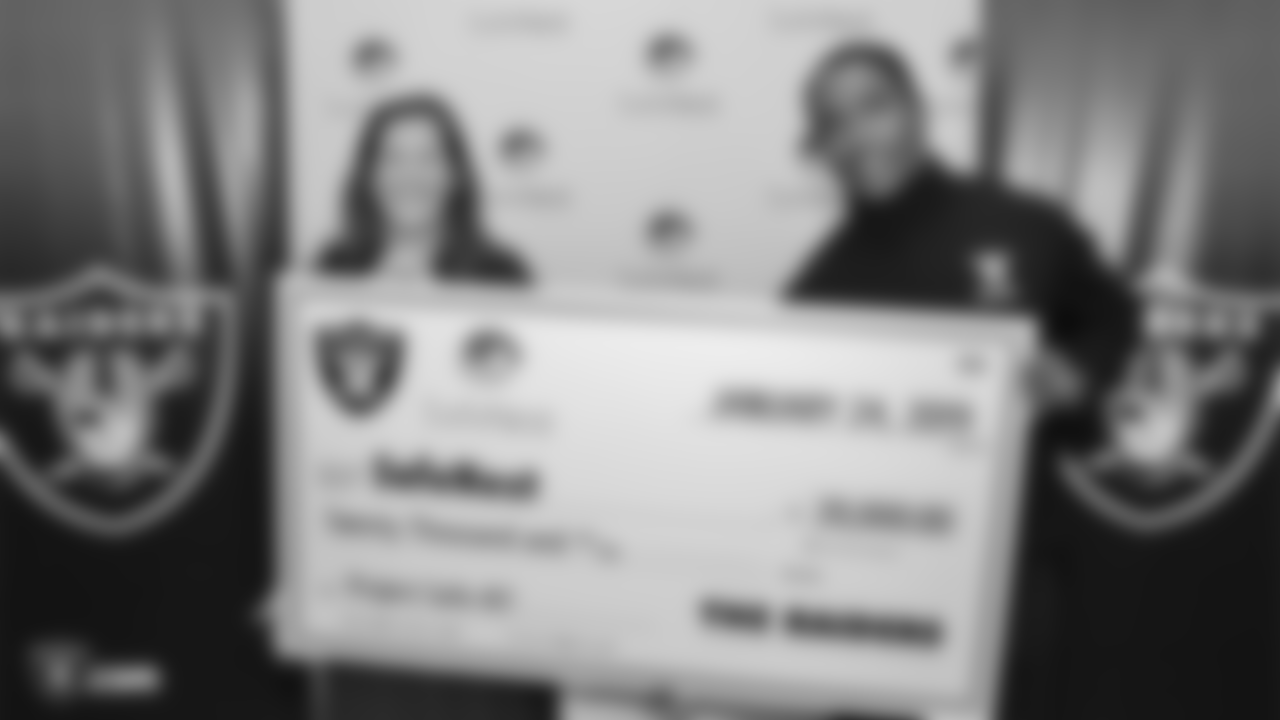 The Raiders, represented by alumnus Leo Gray, present a grant for Project Safe 417 (PS417), a program provided by SafeNest in cooperation with Las Vegas Metropolitan Police Department at SafeNest, Thursday, January 24, 2019, in Las Vegas, Nevada.