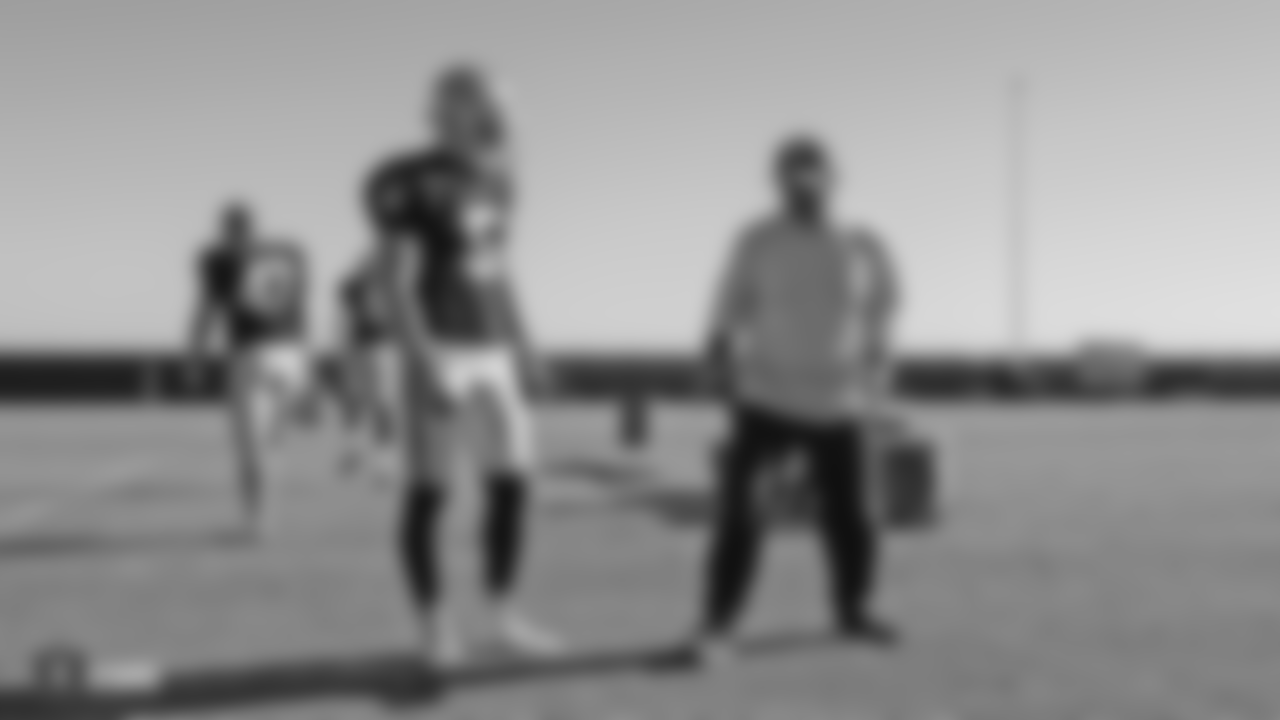 Oakland Raiders punter Johnny Townsend (5) and assistant head coach and special teams coordinator Rich Bisaccia on the field for practice at the Oakland Raiders Practice Facility, Wednesday, November 7, 2018, in Alameda, California.