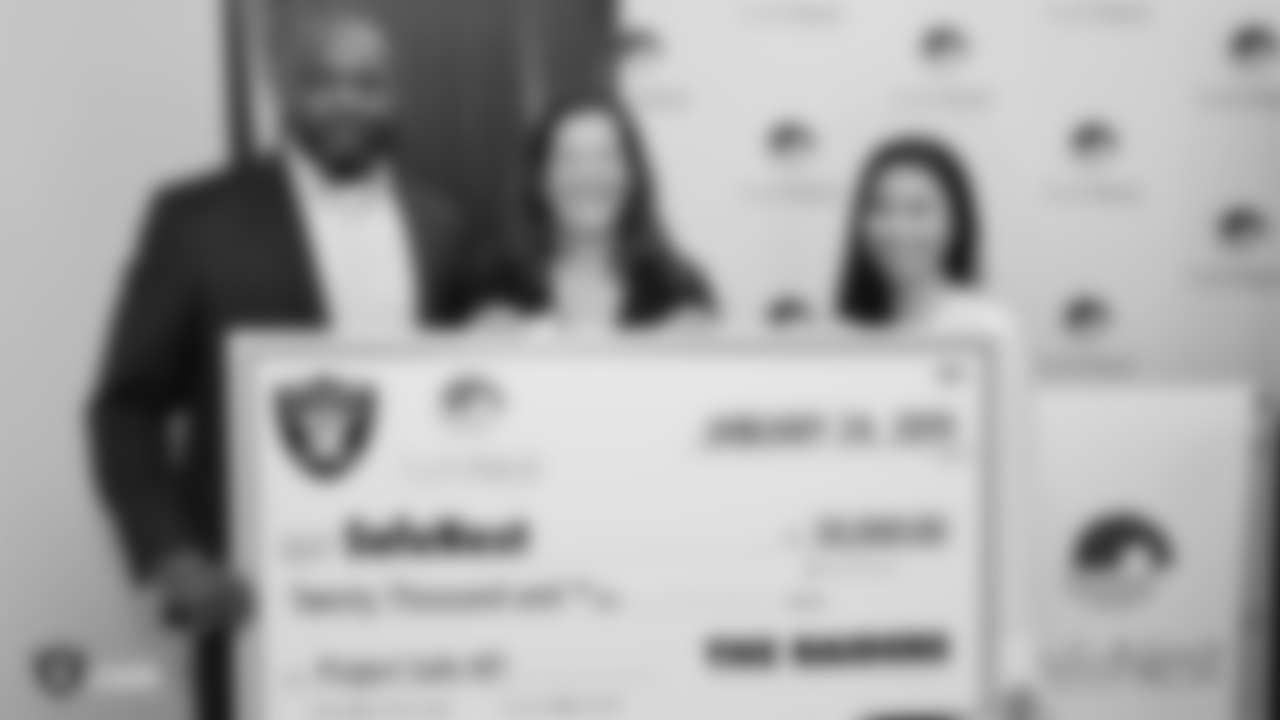 The Raiders, represented by alumnus Leo Gray, present a grant for Project Safe 417 (PS417), a program provided by SafeNest in cooperation with Las Vegas Metropolitan Police Department at SafeNest, Thursday, January 24, 2019, in Las Vegas, Nevada.