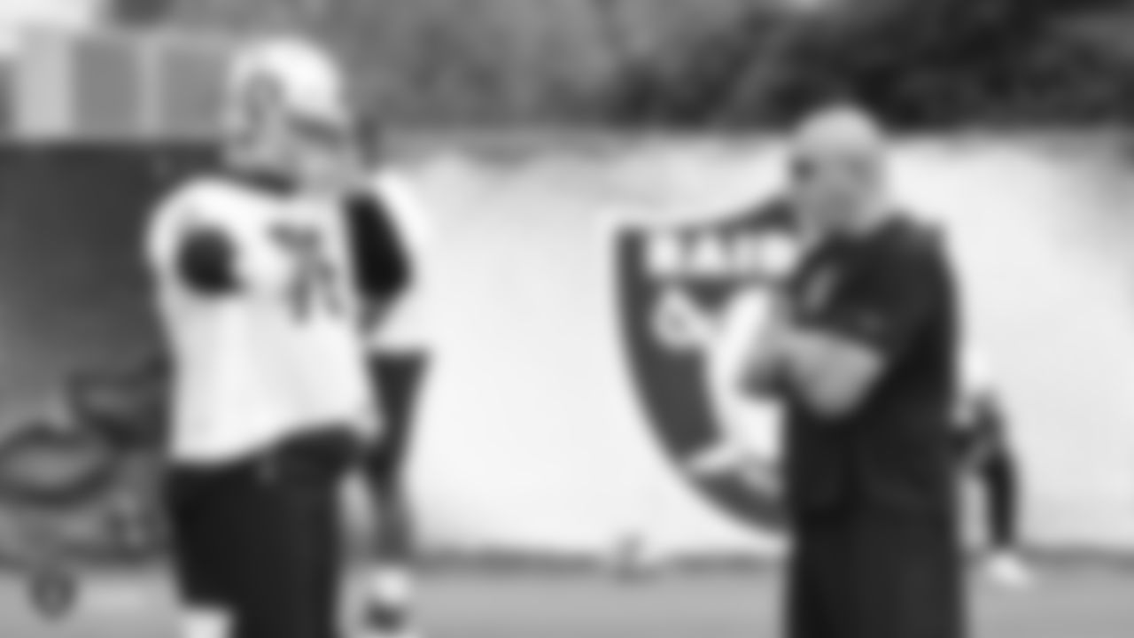 Raiders tackle Tyler Roemer (76) and offensive line coach Tom Cable at an Organized Team Activity (OTA) at the Raiders Practice Facility in Alameda, Calif.