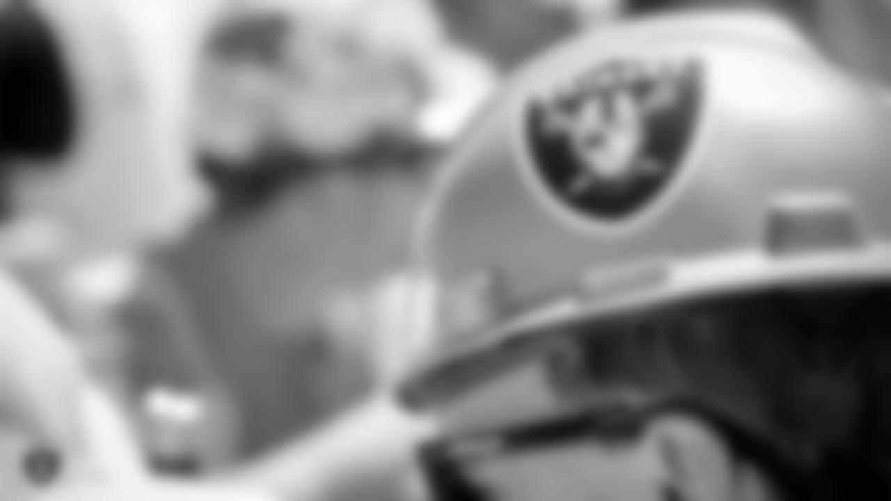 Staff members from the Raiders front office spend the day with construction workers of the Henderson Headquarters worksite by handing out lunches and sharing a meal.