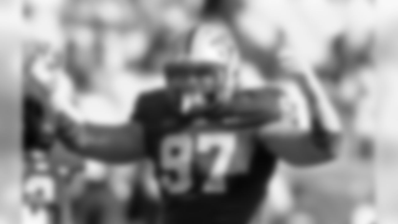 In this photo taken on Sept. 28, 2013, Pittsburgh defensive lineman Aaron Donald inspires the fans to make noise as he plays in an NCAA football game against Virginia in Pittsburgh. Donald, the most-decorated defensive player during the 2013 college football season with four major awards, could be the Panthers' highest draft pick since wideout Larry Fitzgerald was taken third overall by the Arizona Cardinals in 2004. (AP Photo/Keith Srakocic)