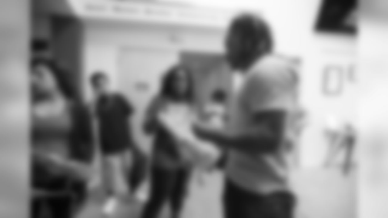 Cornerback (23) Nickell Robey-Coleman of the Los Angeles Rams gives away backpacks to students at A Place Called Home, Wednesday, September 5, 2018, in Los Angels, CA. (Jeff Lewis/Rams)