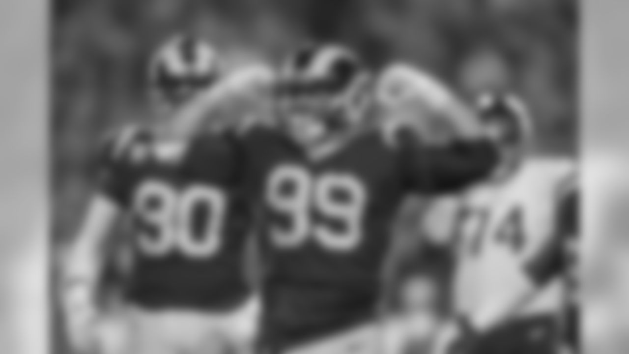 Defensive tackle (99) Aaron Donald of the Los Angeles Rams sacks quarterback (8) Kirt Cousins of the Minnesota Vikings and celebrates during the Rams 38-31 victory over the Vikings in an NFL Week 4 Thursday Night Football game, Thursday, September 27, 2018, in Los Angeles, CA. (Jeff Lewis/Rams)