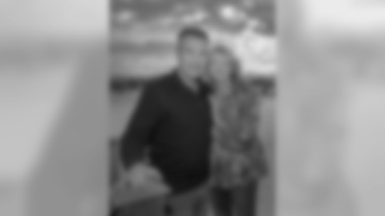 Doug and Natalie Hill, Taysom's father and mother, pose for a portrait on their back porch. Doug built the house with the assistance of Taysom and his siblings.
