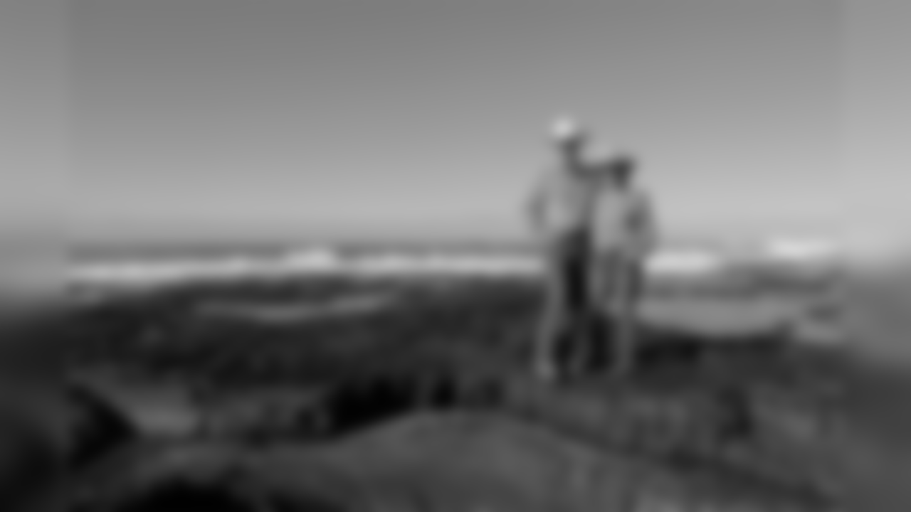 Cynda and Keith Unger, parents of New Orleans Saints center Max Unger, stand atop an ancient lava flow on the shores of Hookena Beach, Wed, Jan. 16, 2019, in Hookena, Hawaii. NFL football center Max Unger grew up on his family's McCandless Ranch, a 7000 acre working cattle ranch that starts on the slopes of Mauna Loa stretches down to Hookena Beach. According to family, Max spent his youth swimming and camping at Hookena Beach. (Marco Garcia for the New Orleans Saints)