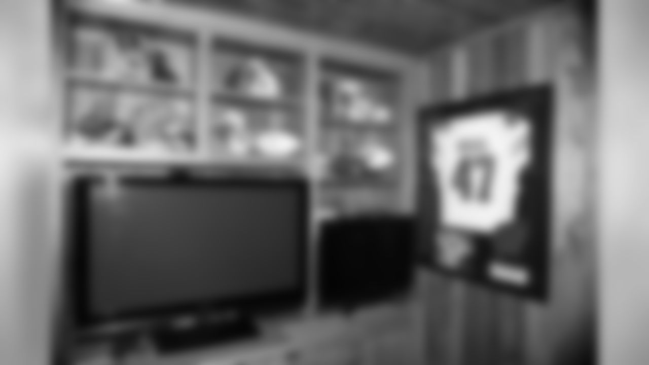 Vince Biegel's college uniform displays proudly in the Biegel home