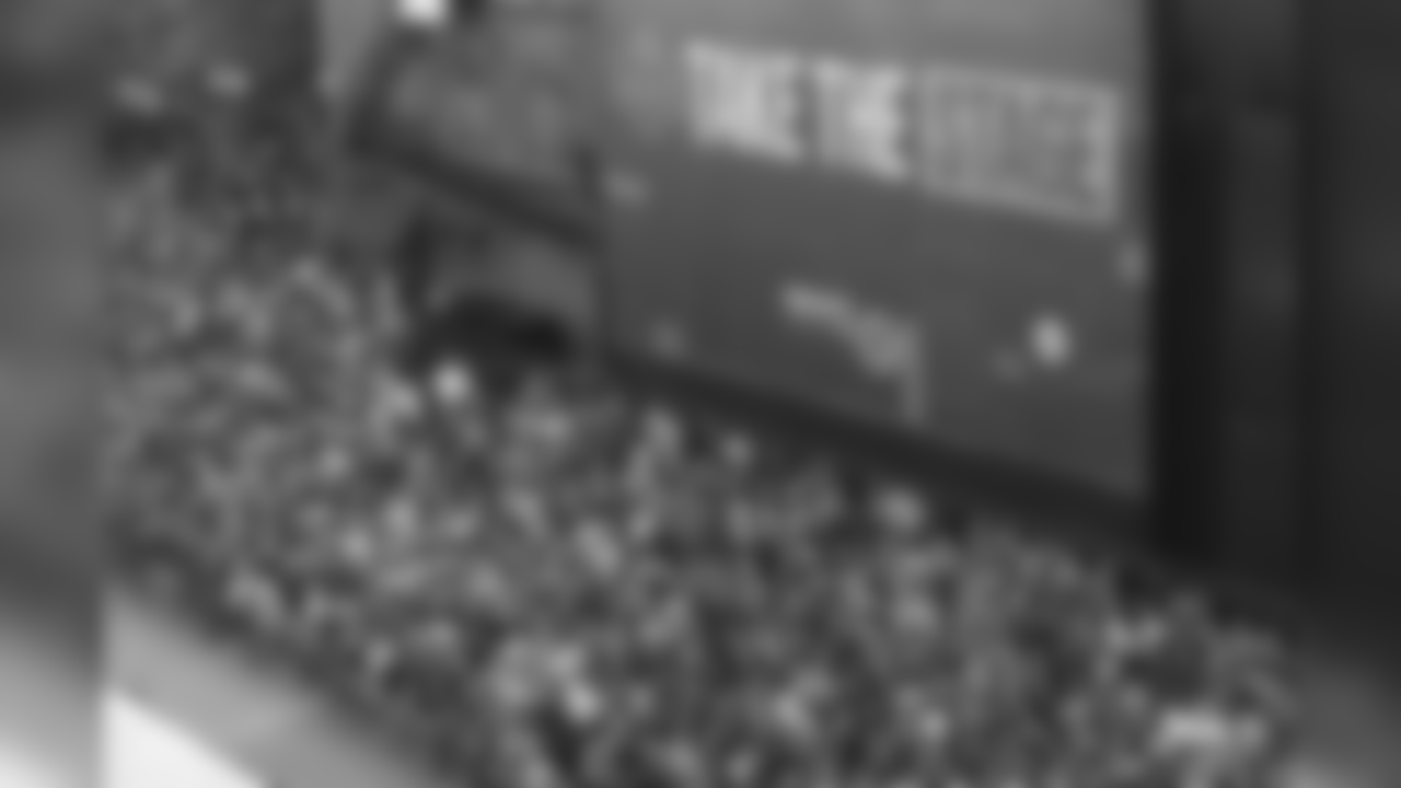 Fans crowd onto Broadway to watch the 2019 NFL Draft, Friday, April 26, 2019, in Nashville, Tenn. (AP Photo/Doug Benc)
