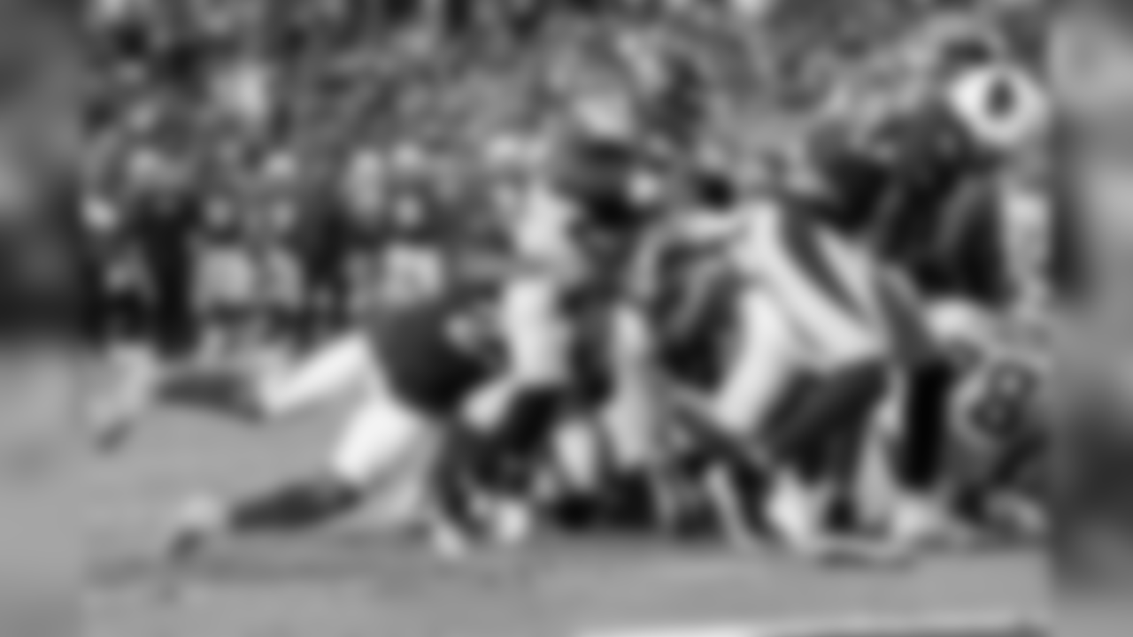 Seattle's Mike Davis scores his second touchdown of the afternoon, dragging an Arizona defender with him into the end zone.