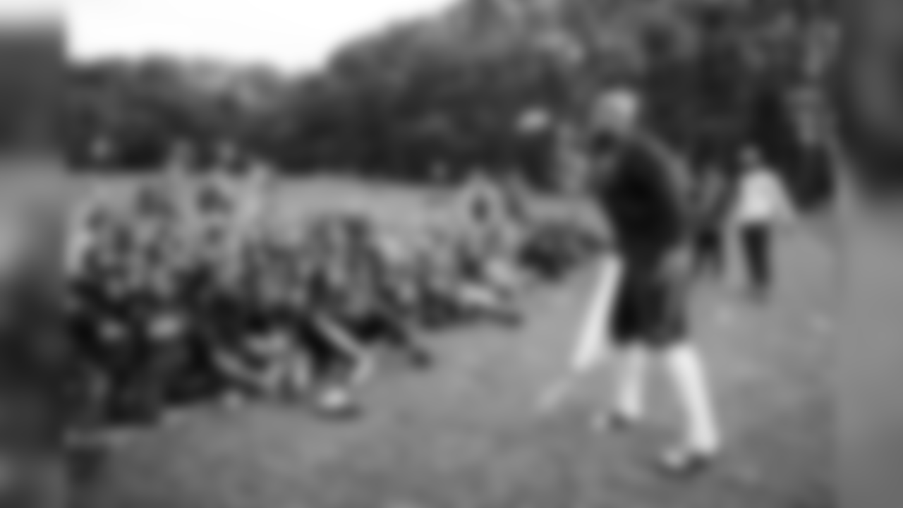 Offensive lineman Elijan Nkansah entertains kids at an NFL UK Play 60 event on Friday.