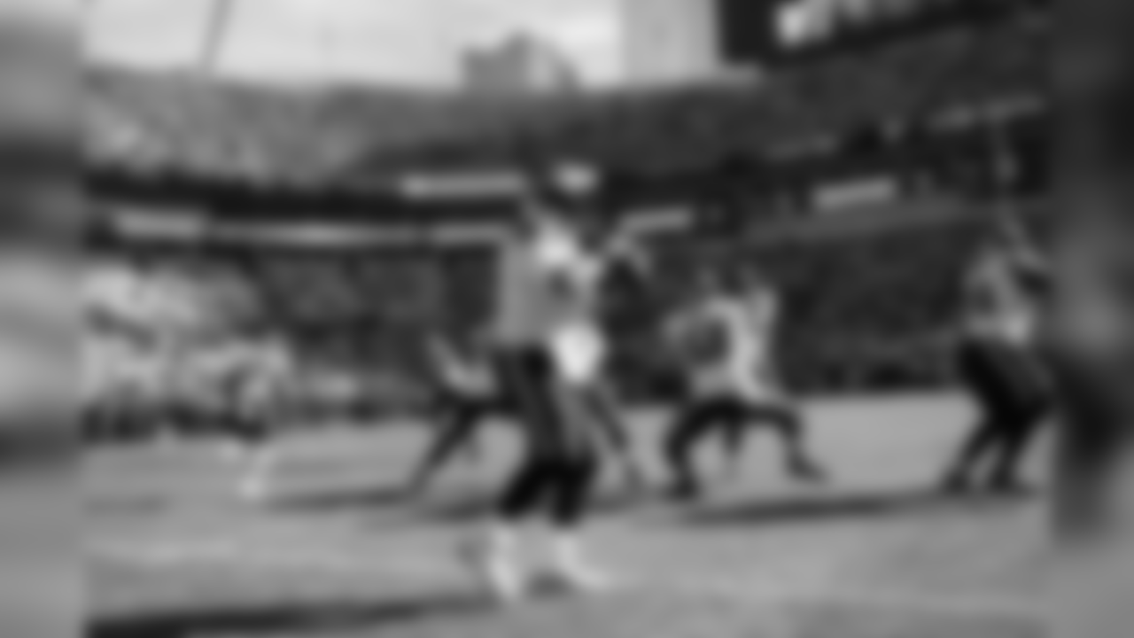 Seahawks quarterback Russell Wilson drops back for a pass during the team portion of pregame warmups.