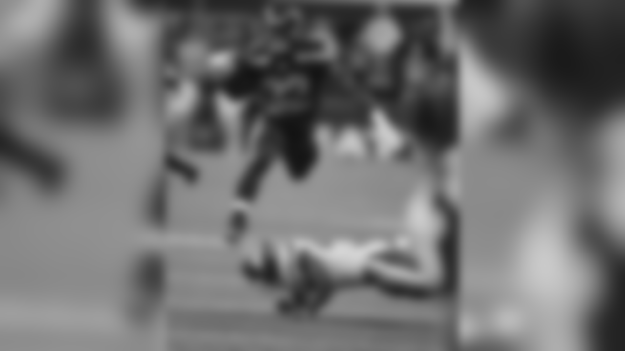 Seattle Seahawks running back Chris Carson (32) hurdles Minnesota Vikings cornerback Jabari Price during the first half of an NFL football preseason game, Friday, Aug. 18, 2017, in Seattle. (AP Photo/Scott Eklund)