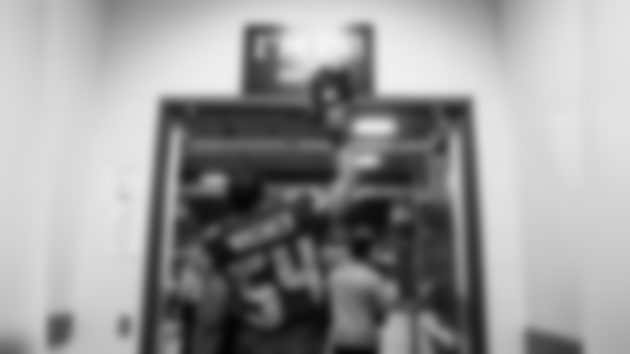 Linebacker Bobby Wagner "taps in" as he leaves the locker room for the field.