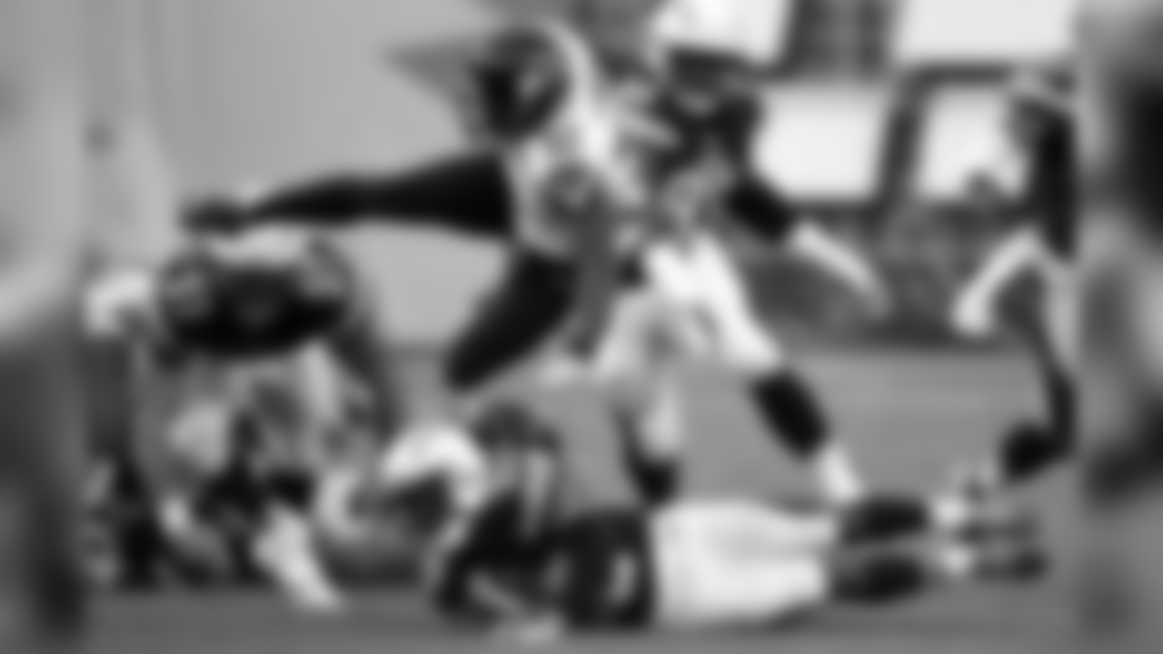 Seattle Seahawks running back Robert Turbin (32) leaps over San Diego Chargers cornerback Richard Crawford (35) during the second half of a preseason NFL football game Saturday, Aug. 29, 2015, in San Diego. (AP Photo/Denis Poroy)