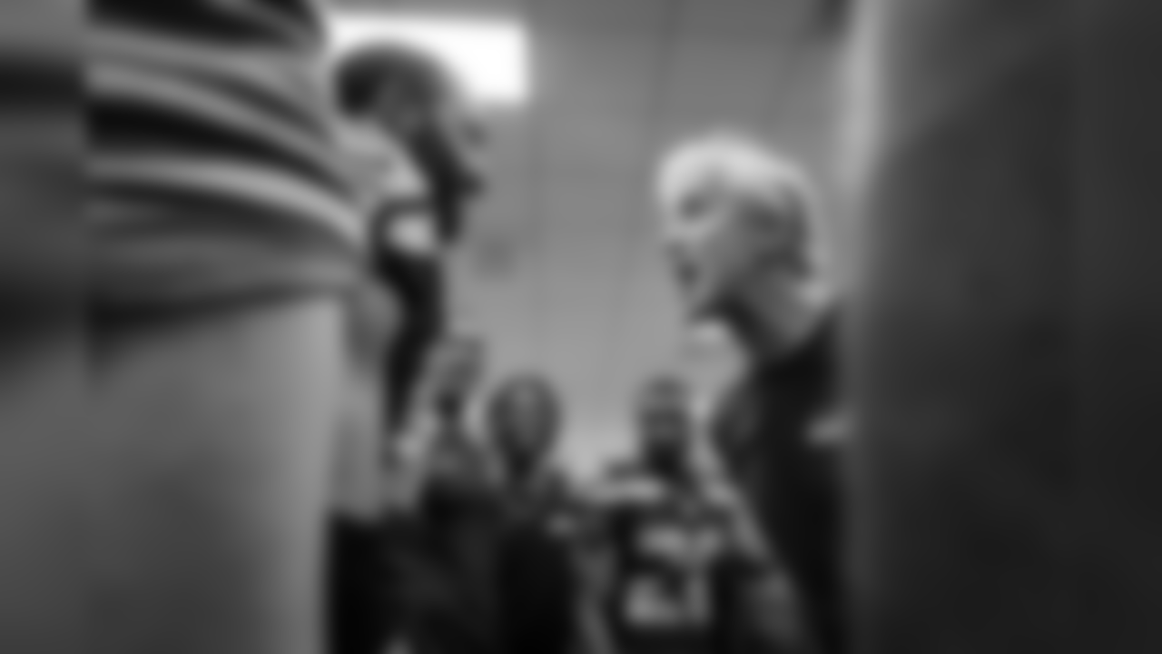 In the victorious Seahawks locker room, head coach Pete Carroll yells in the direction of receiver Doug Baldwin.