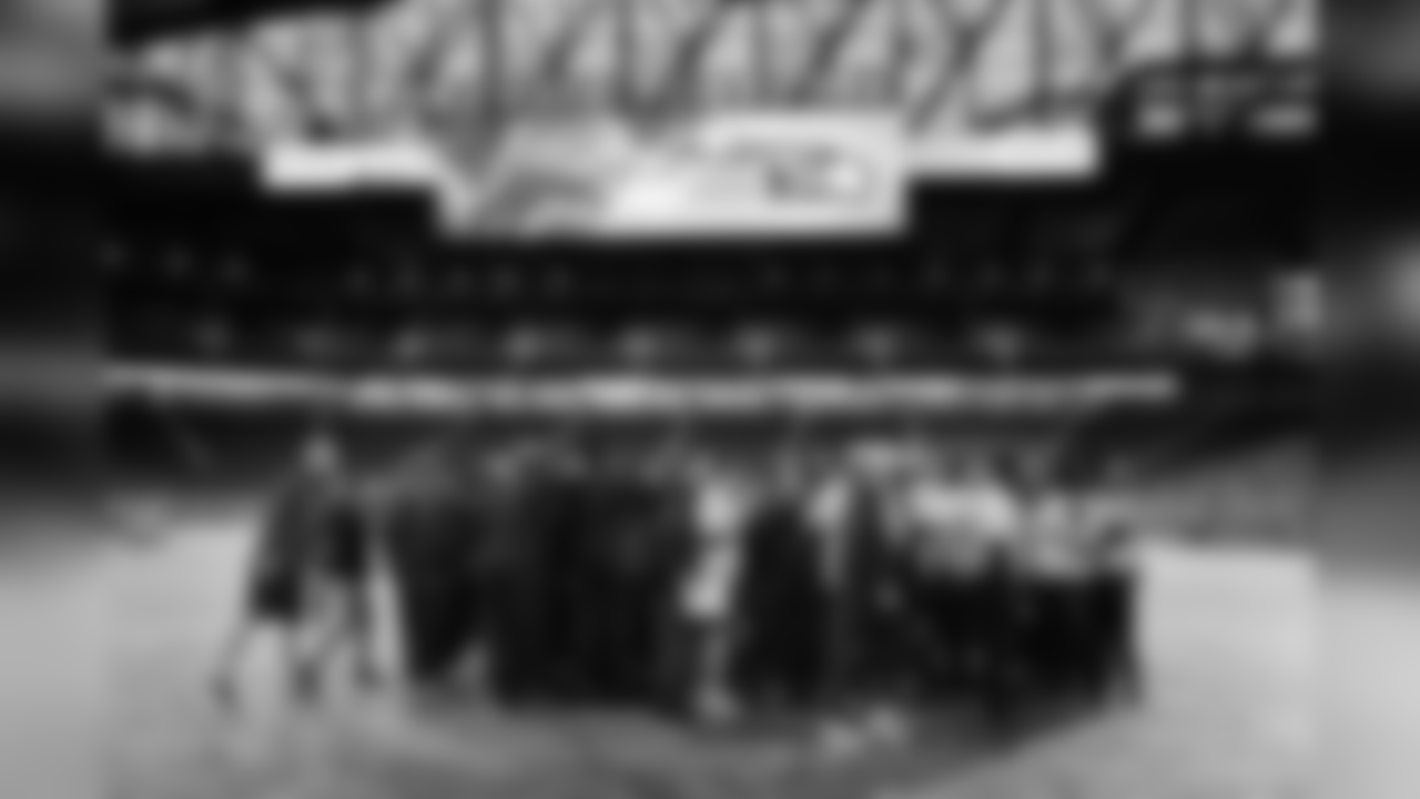 After walkthru was a quick visit to Ford Field for the team, who gathered on the field that was still covered from the previous night's concert featuring country star Luke Bryan.
