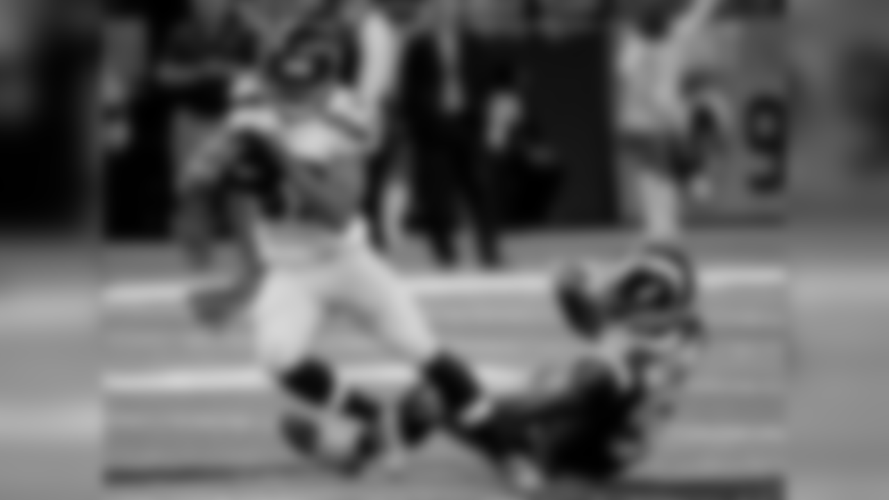Seattle Seahawks wide receiver Doug Baldwin, left, slips past St. Louis Rams linebacker Alec Ogletree after catching a pass for a 49-yard gain during the first quarter of an NFL football game Sunday, Oct. 19, 2014, in St. Louis. (AP Photo/L.G. Patterson)