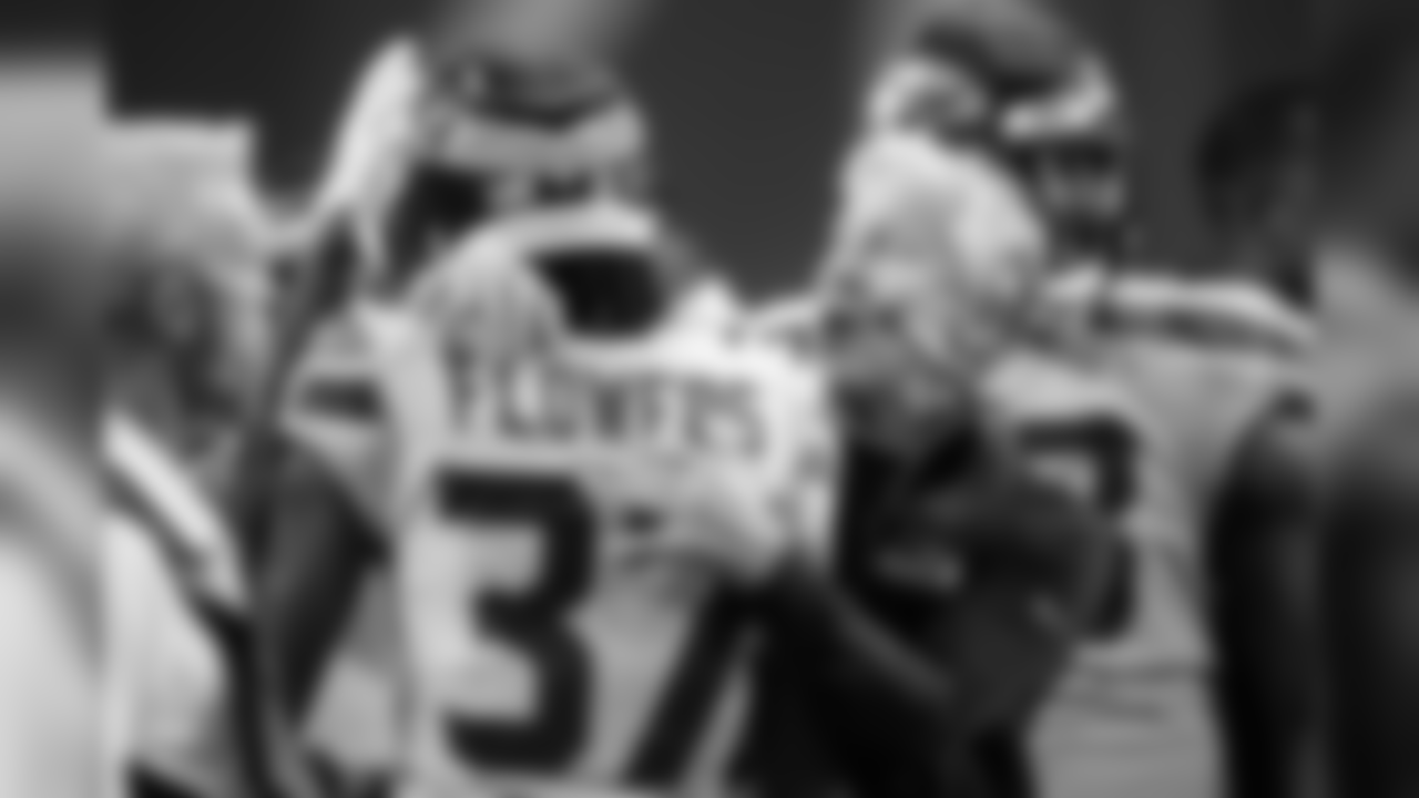 Seattle head coach Pete Carroll congratulates rookie cornerback Tre Flowers after Flowers forced a turnover in the first half.