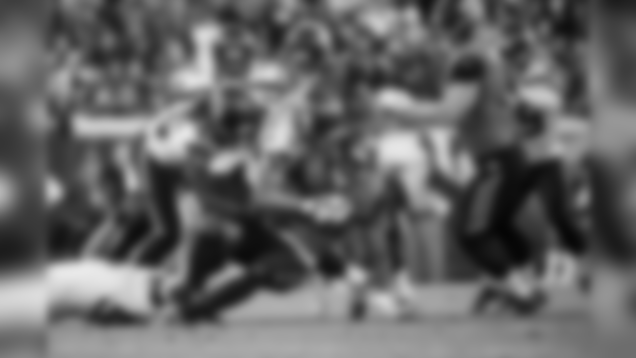 Seattle's K.J. Wright (on ground), Bradley McDougald and Shaquill Griffin tackle Jaguars running back Leonard Fournette.