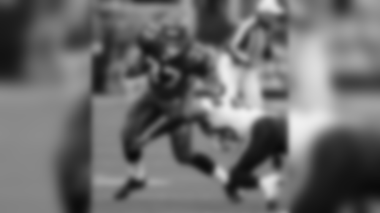 Seattle Seahawks' Shaun Alexander (37) runs as San Diego Chargers' Terrence Kiel moves in on a first quarter run in a football game Sunday, Dec. 24, 2006, in Seattle. (AP Photo/Elaine Thompson)