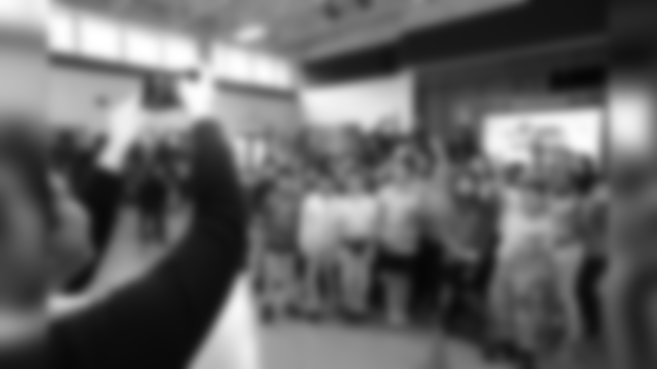 An image from the March 8, 2019 event at Alexander Elementary in which TORO, players and cheerleaders led students in math drills and hosted a Papa John's pizza party.