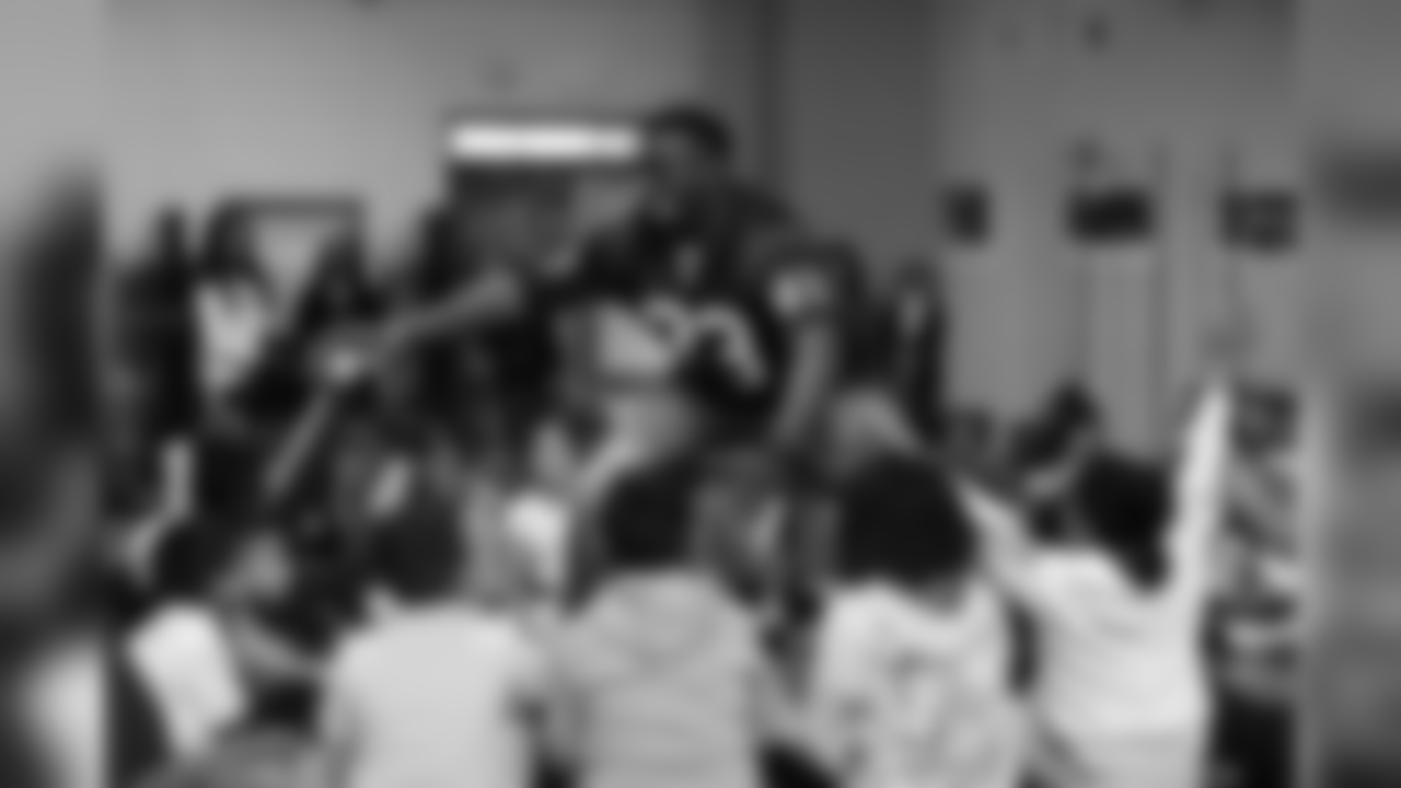 An image from the March 8, 2019 event at Alexander Elementary in which TORO, players and cheerleaders led students in math drills and hosted a Papa John's pizza party.