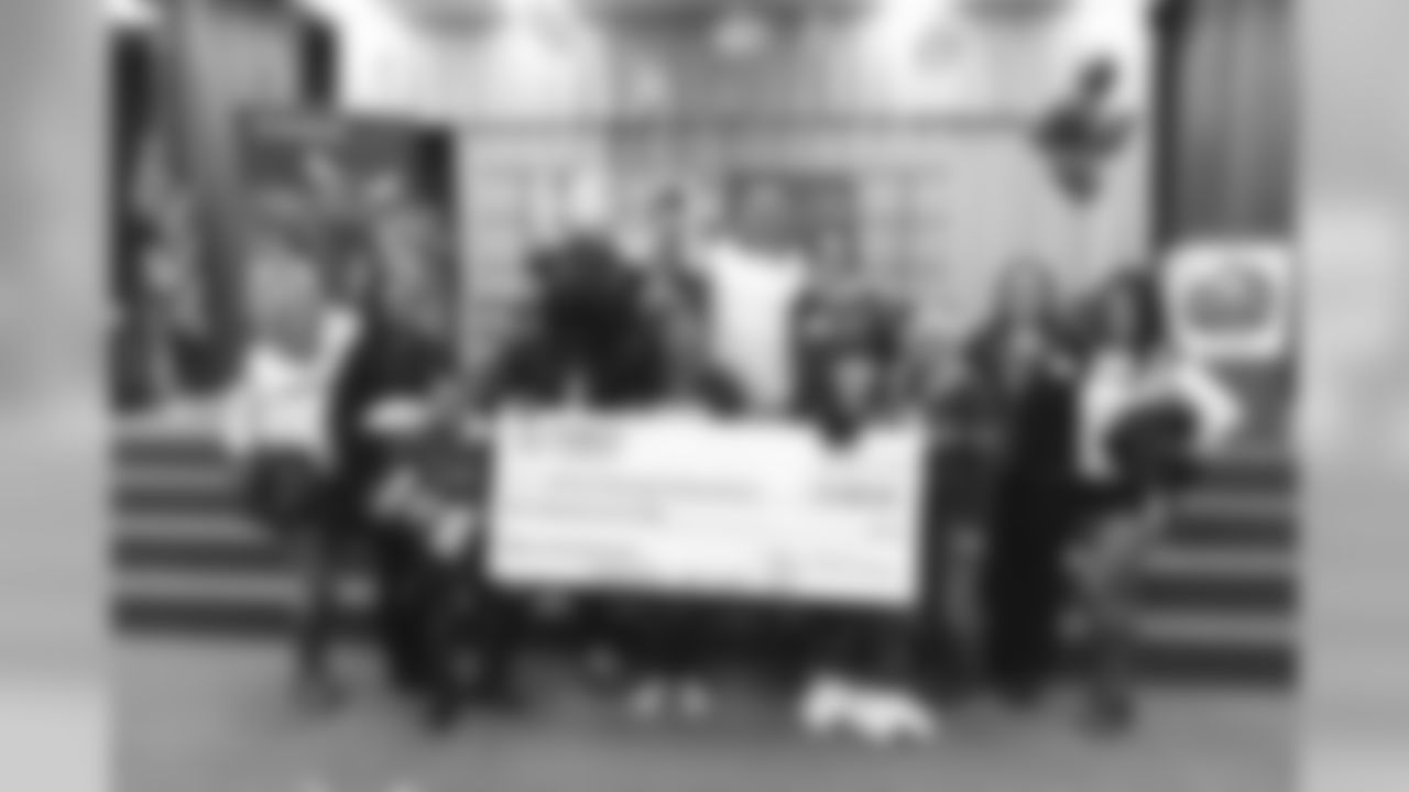 An image from the Nov. 13, 2018 corporate development event at Hirsch Elementary School in Spring, TX. Brian Peters, TORO, and cheerleaders visited the students and presented awards and a big check to teachers.