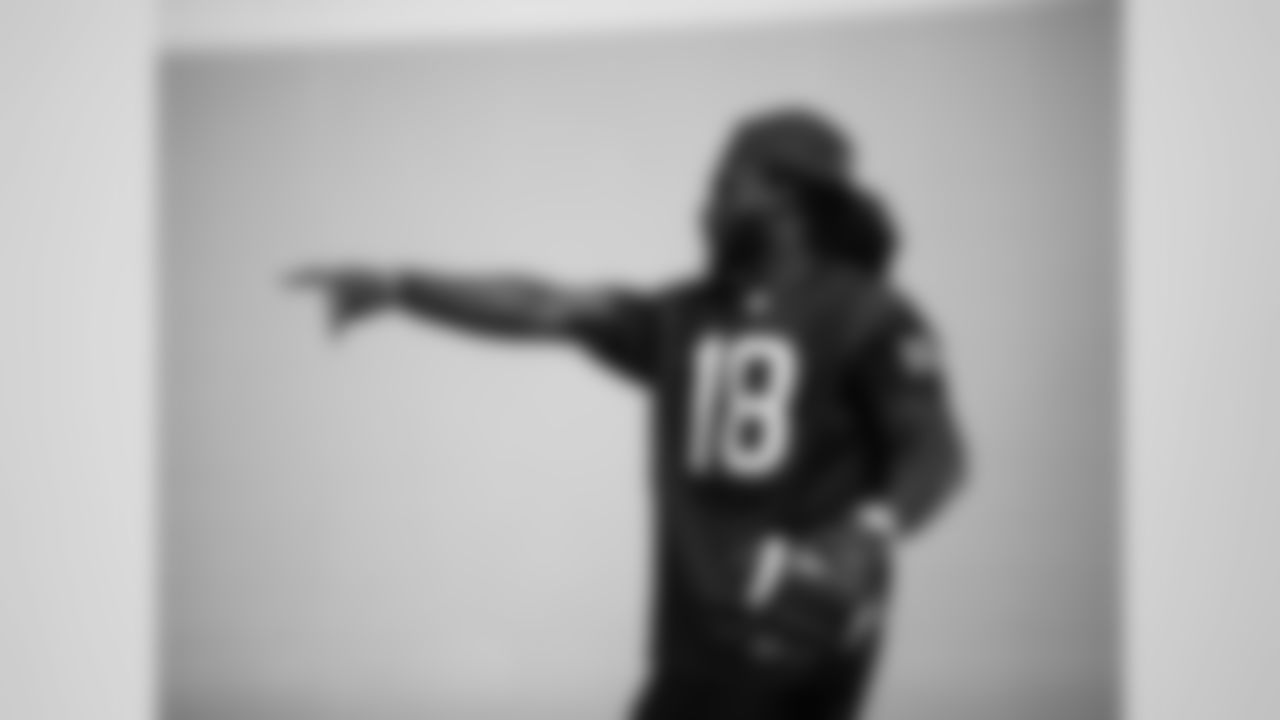 An image from the Sept. 25, 2018 community development event in which Sammie Coates Jr. and Julien Davenport played basketball and ate pizza with local students.